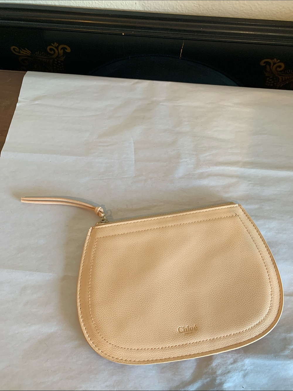 Chloé leather pouch with top zip and subtle logo embossing